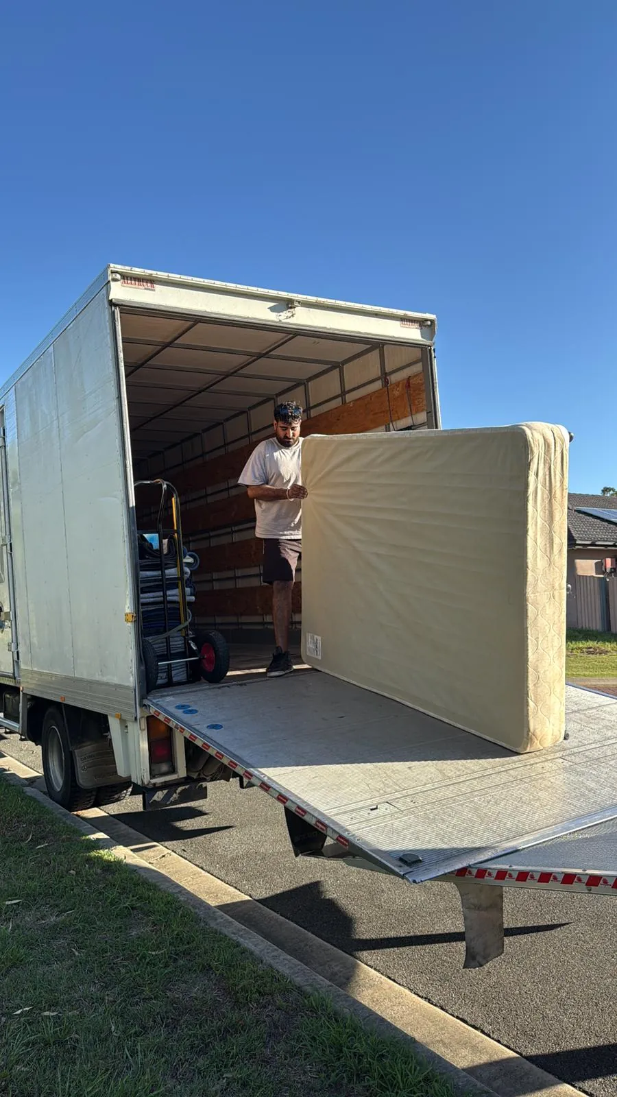 Furniture being loaded using the truck platform