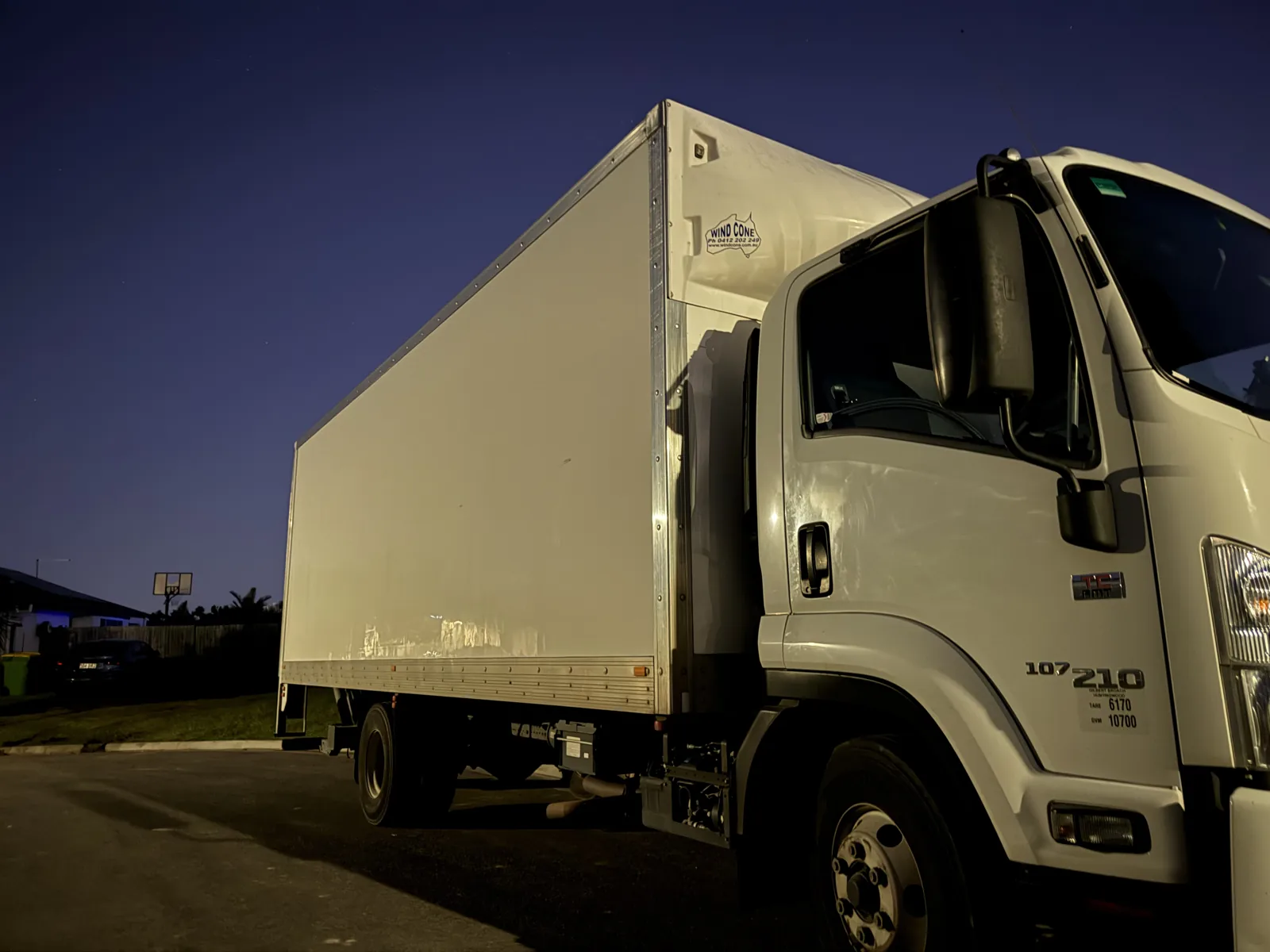Removal truck photographed at dusk